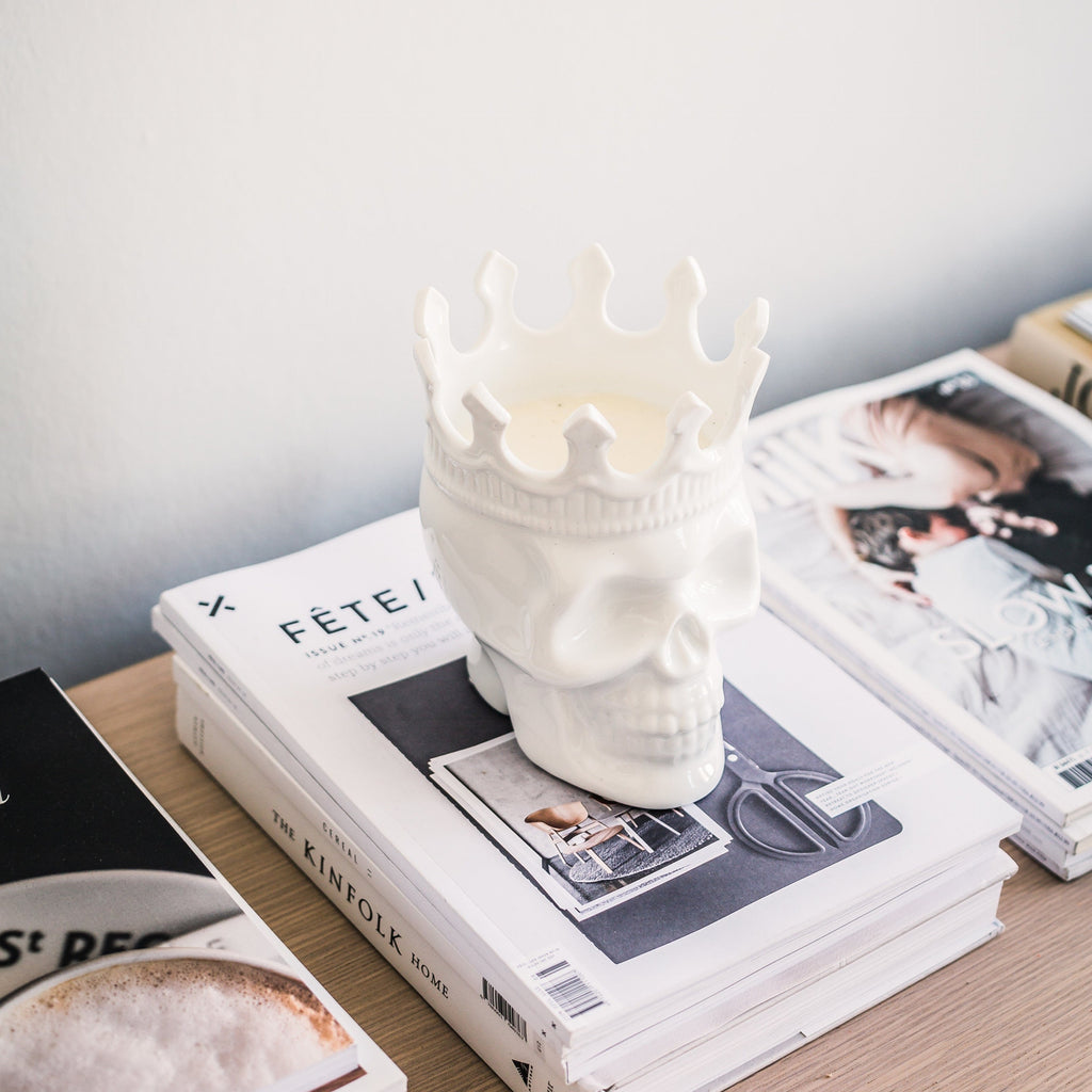 white skull candle with a crown