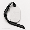 White Eternum Santal Cave perfumed ceramic with embossed Thompson Ferrier logo and black branded ribbon.
