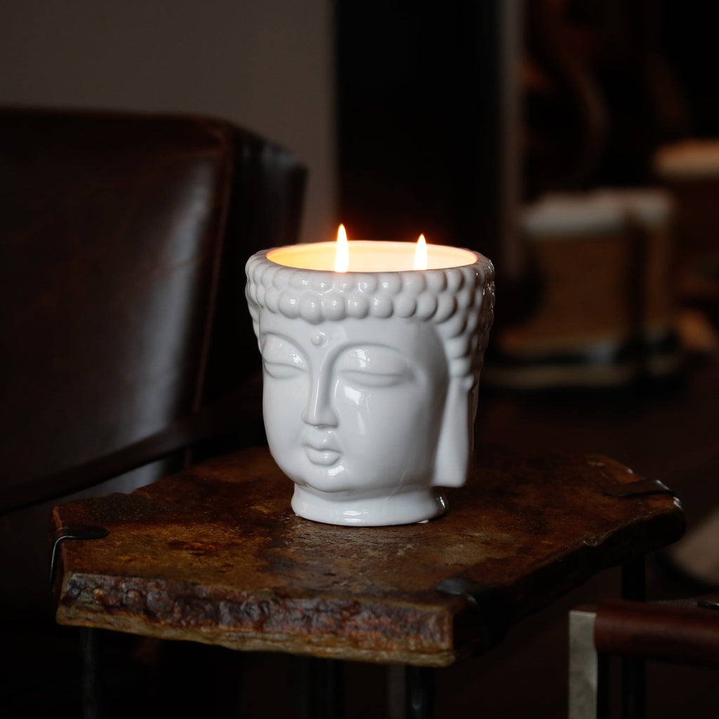 white buddha head candle