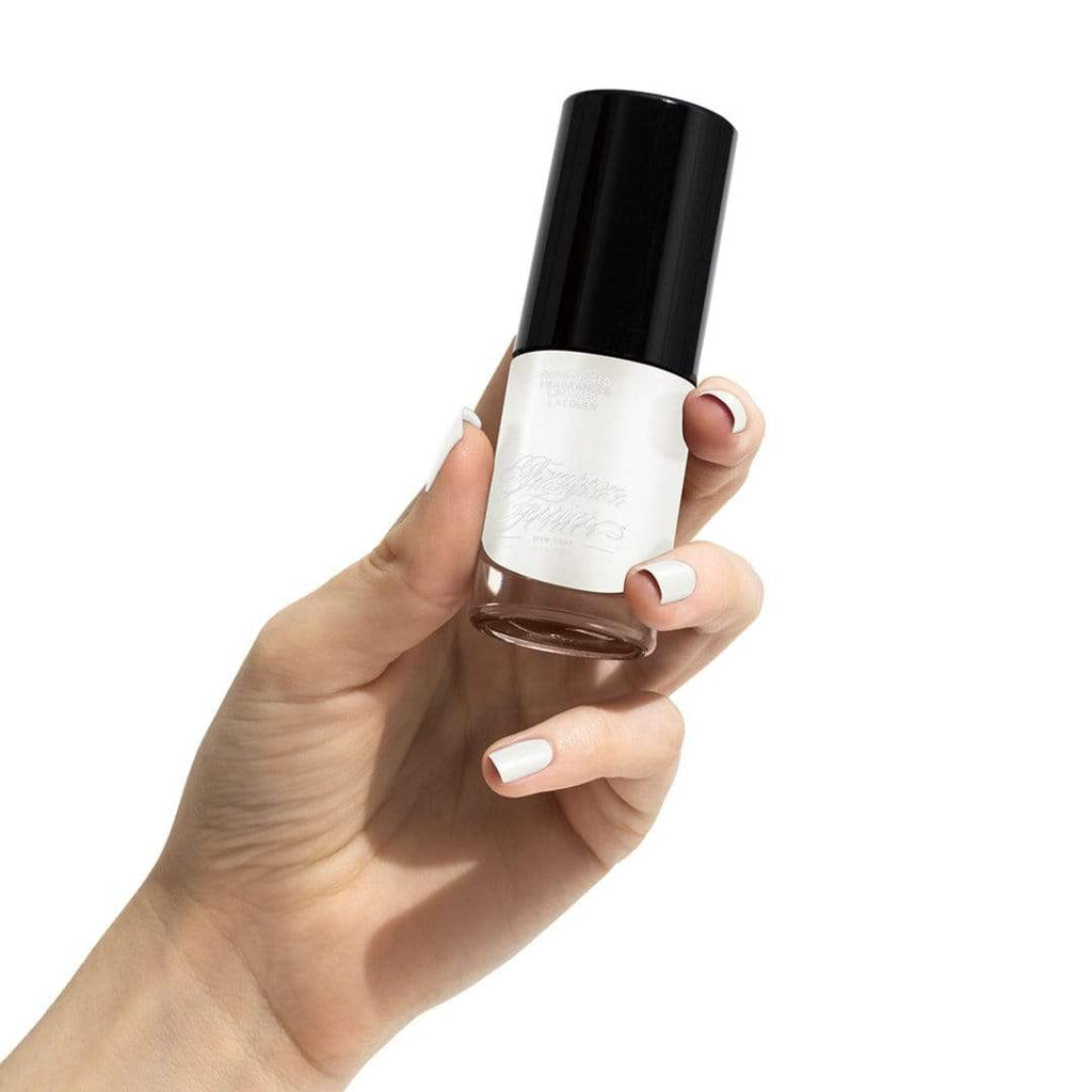 TF181001-bottle-of-white-nail-polish