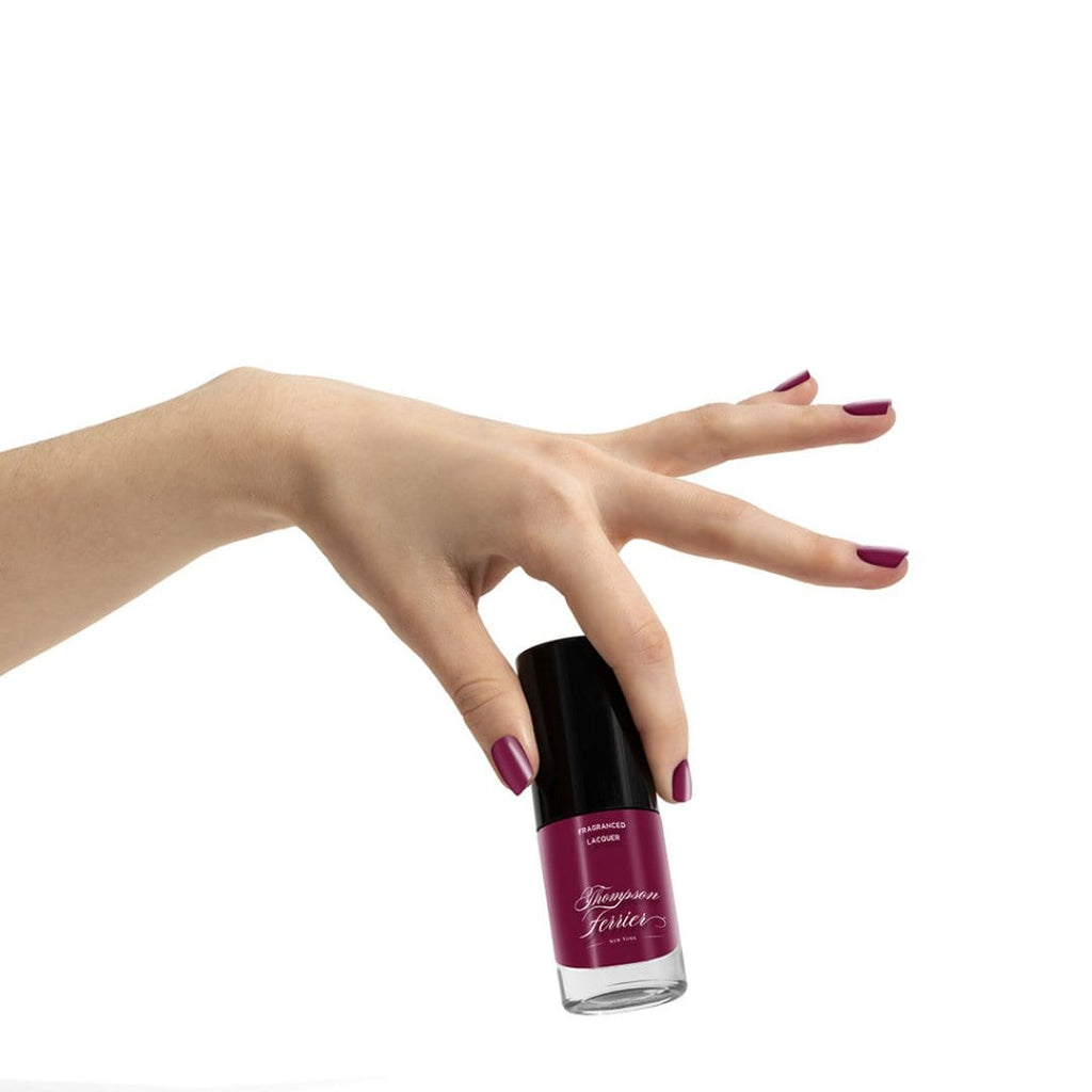 glass-nail-polish-bottle-with-plum-colored-nail-polish