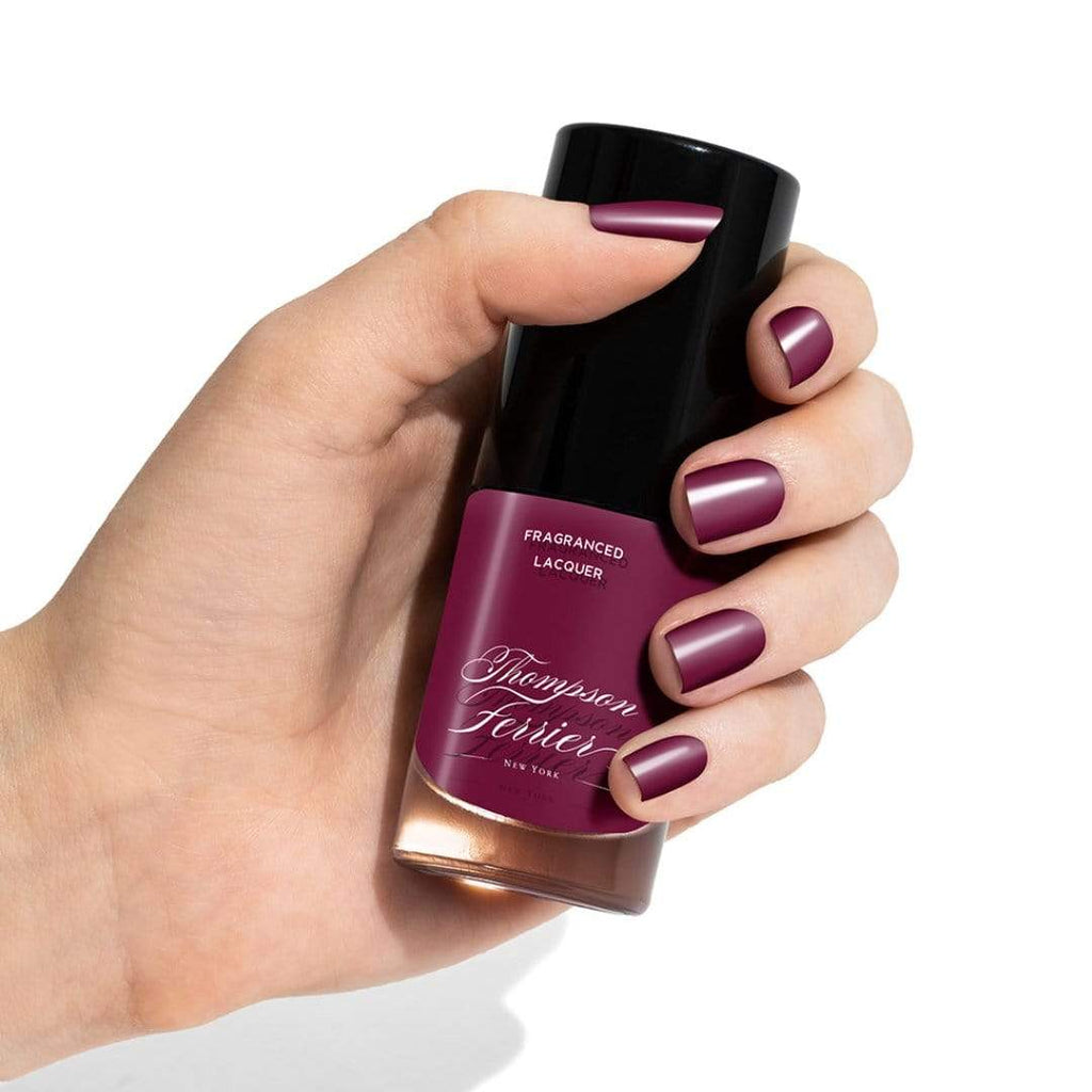 glass-nail-polish-bottle-with-plum-colored-nail-polish