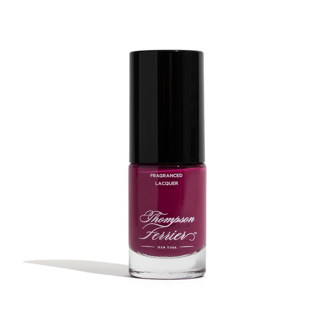 glass-nail-polish-bottle-with-plum-colored-nail-polish