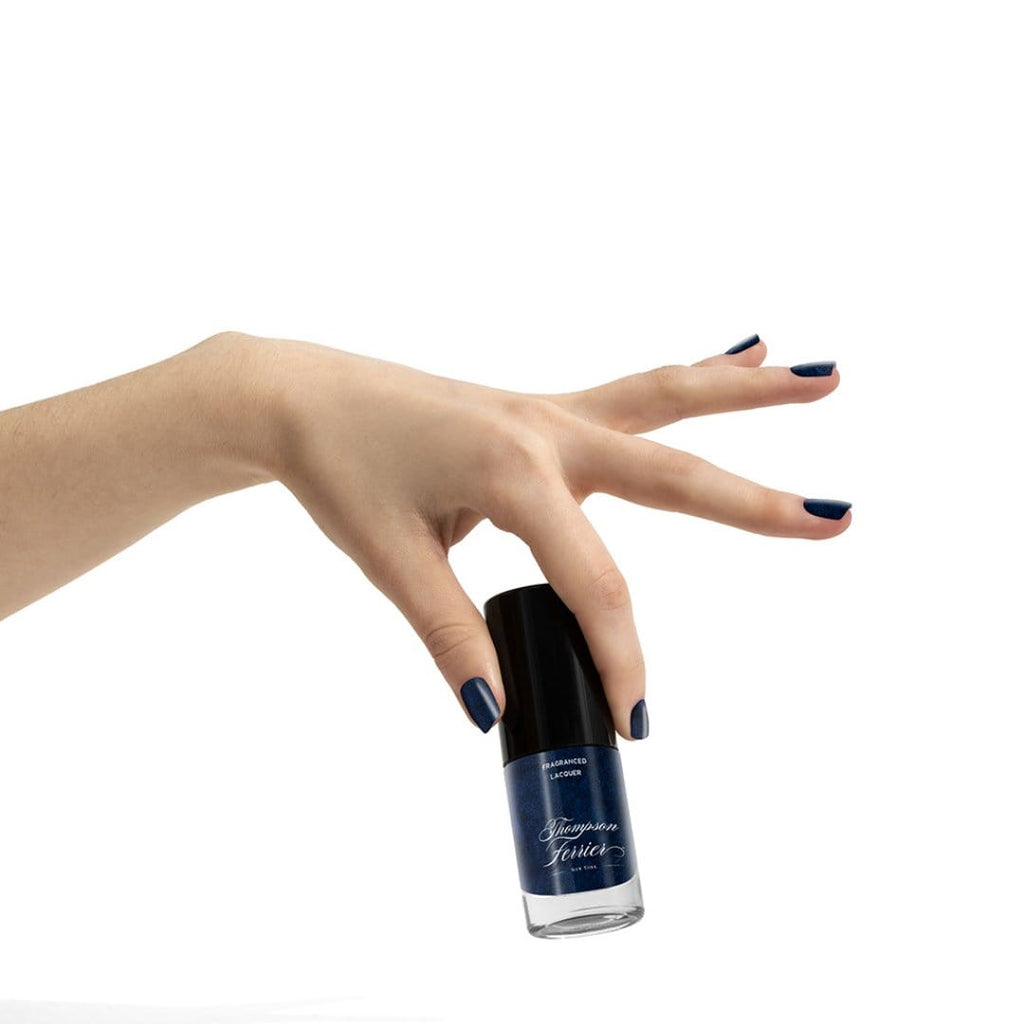 glass-nail-polish-bottle-with-blue-polish