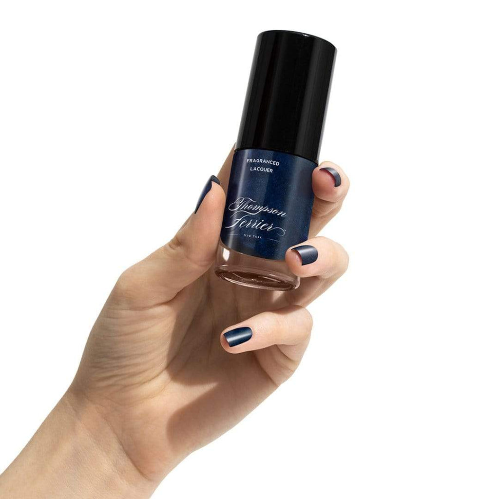glass-nail-polish-bottle-with-blue-polish